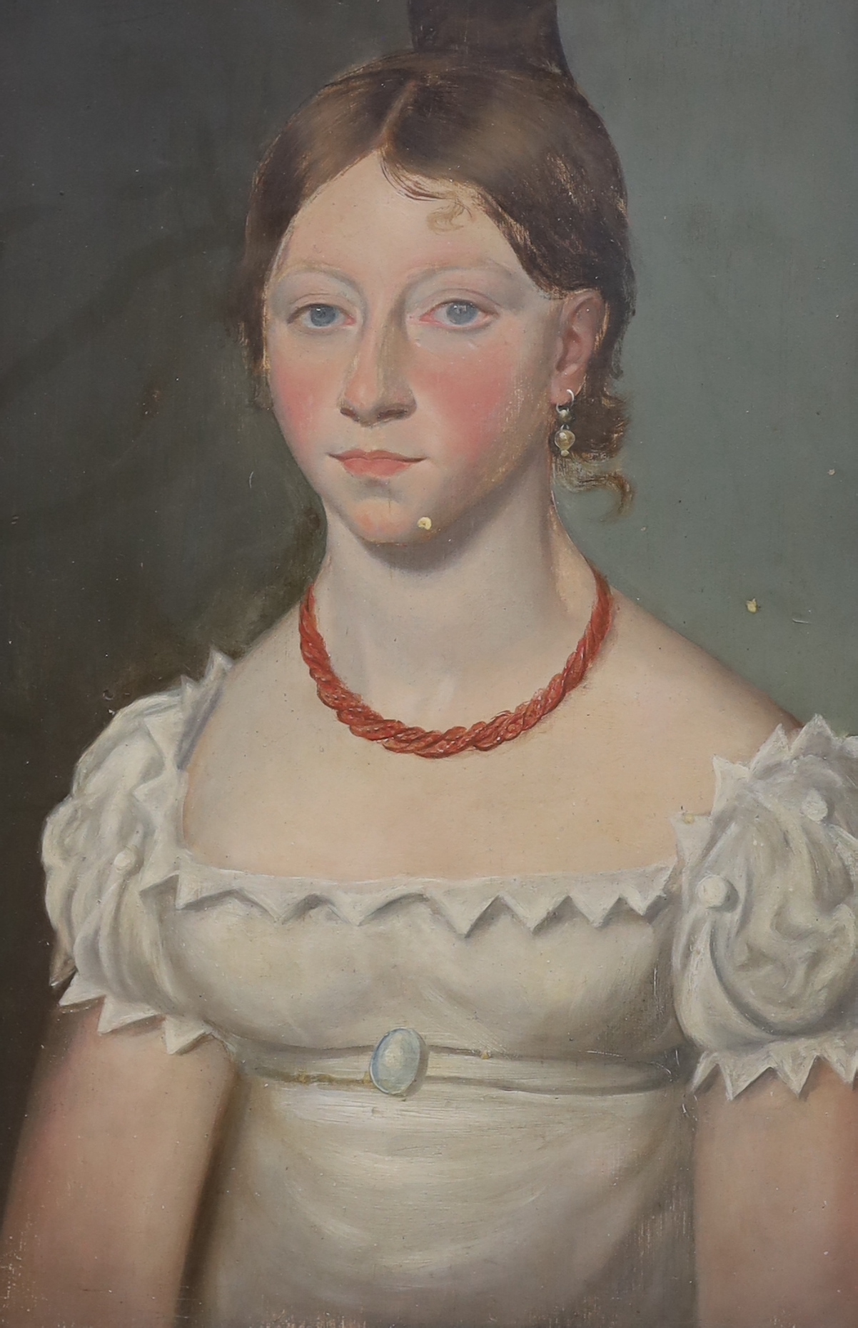 19th century Naive School, oil on board, Young lady wearing a coral necklace, 41cm x 28cm
